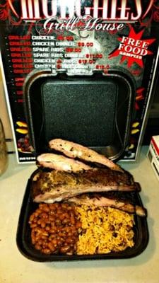 Ribs with baked beans and pigeon peas and rice.