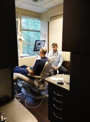 Dr. MacInnes chatting with a patient.