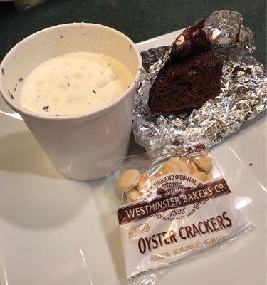 To-go fish chowder with a side of chocolate cake for Lent as a fundraiser for local charities.