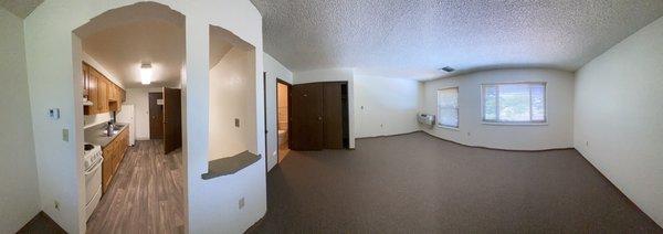 Panorama of studio apartment with new kitchen floor & new carpet.