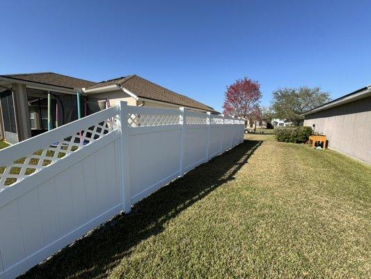 White vinyl  fence with lattice top infill