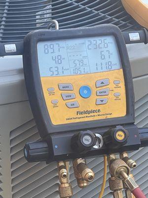 Checking refrigerant pressures for superheat and sub cooling.