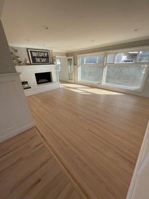 Complete refinish on original 60+ year old red oak hardwood flooring.