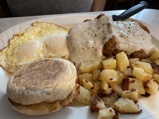 Country fried steak and eggs.