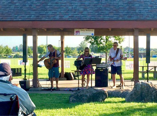 Amy Montrois Band performing live music under Pavilion