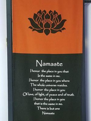 Namaste backdrop behind heated table