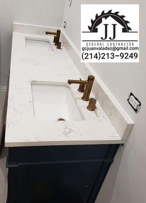 Custom countertop for your bathroom or kitchen.  Quartz on 72" custom cabinet with polished gold faucets and square undermounted sinks.