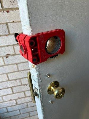 fresh installation in progress for installing a new deadbolt lock on residential lock