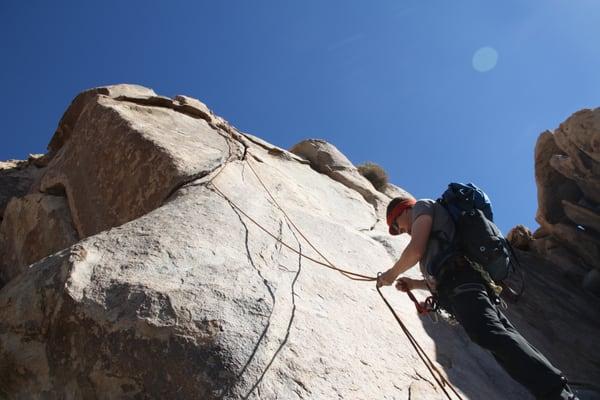 Climbing at Atlantis rock in Joshua Tree