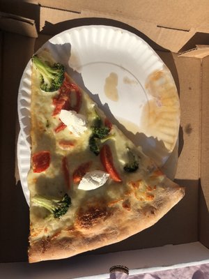 Vegetarian slice of white sauce with broccoli and bell peppers, and cheese