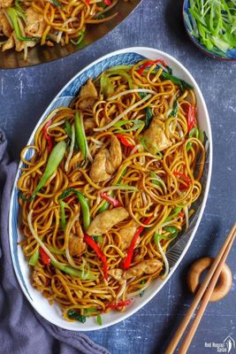 Chicken Chowmein is a popular Chinese dish consisting of stir-fried noodles, typically with chicken, vegetables such as bell peppers, onion.