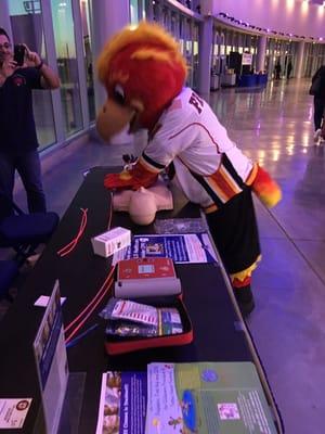 Frankie from The Stockton Heat practices compressions at a hockey game LFTC was invited to