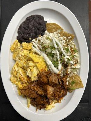 Chilaquiles Verdes con Cochinita Pibil. 
Green Sauce Chilaquiles with Pulled Pork.