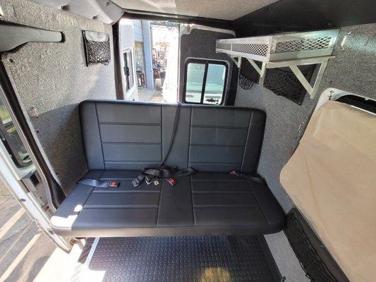 Sleeper bench seat in sprinter van