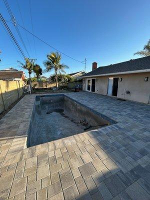 Paver install after ground leveling and drainage install.