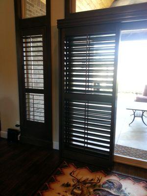 The perfect solution for a patio door - bypass wooden shutters.