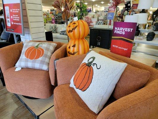 Near the front entrance.  Fall pillows and Jack-o-lantern decoration.