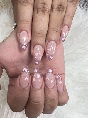 Gel X set with glittery tips and cute heart designs