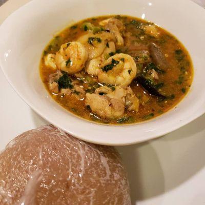 Eba and Okra soup with mixed meats (Authentic Nigerian plate).