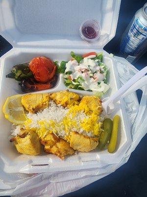 This is a chicken kabob plate the salad is great the grilled tomatoes and jalapenos are amazing and the chicken is delicious.