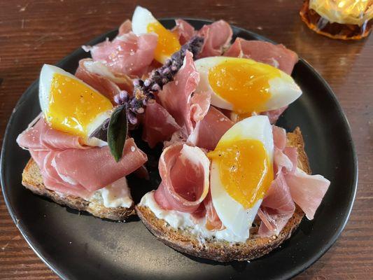 Jammy Egg Toast (stracciatella, prosciutto parma, dill pollen, jammy egg on sourdough toast)