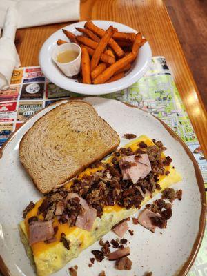 Meatlovers Omelet with a side of sweet potato fries