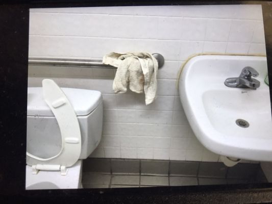 Dirty towel in the one unisex bathroom and trash can filled, yucky.  A good dose of bleach is needed.