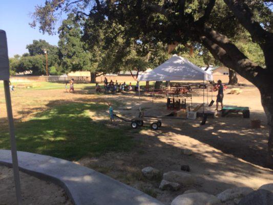 Every morning we gather under the oaks to have announcements and sing!