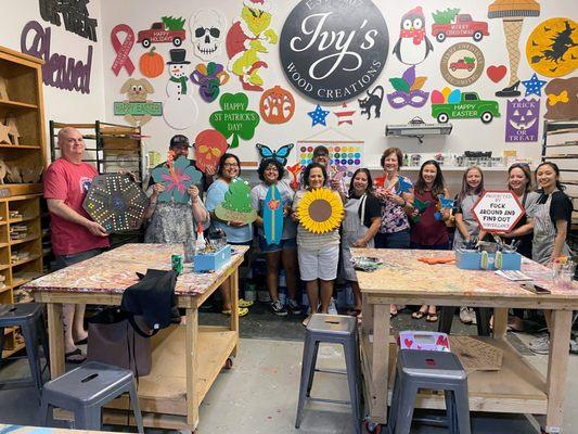 Friends gathering to paint and sip at Ivy's Wood Creations Studio in Roseville