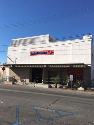 Back of the Bank of America Bank next to the parking lot.