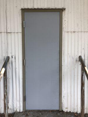 hollow metal exterior door prior to hardware installation at industrial location in Livermore, CA