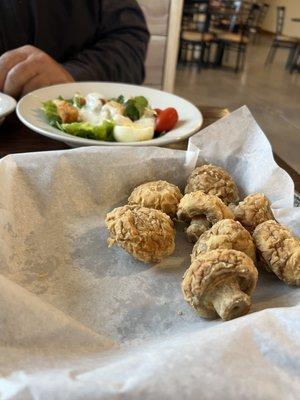 Half eaten, home battered mushrooms and house salad