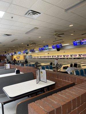 Eating tables outside of bowling area.