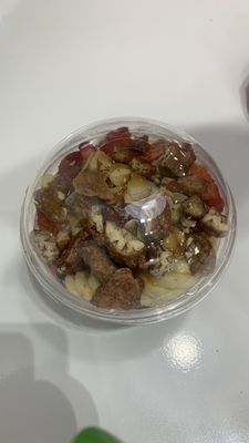 Cacao bowl with bananas, strawberries, almond shavings, and granola with caramel drizzle!