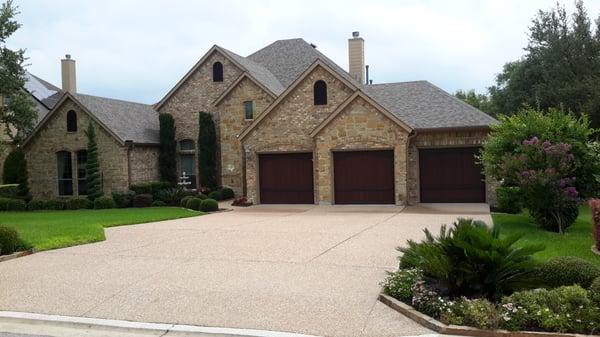 Austin Texas - TAG oversaw the replacement of the roof, detachment and reset of solar panels and  staining gable vents and garage doors.