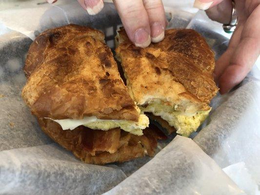 Bacon, egg, and cheese croissant (aerial view).