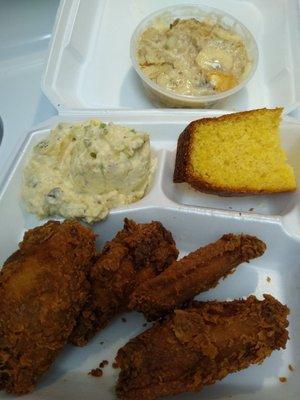 Fried chicken wings with potato salad, cornbread & banana pudding.