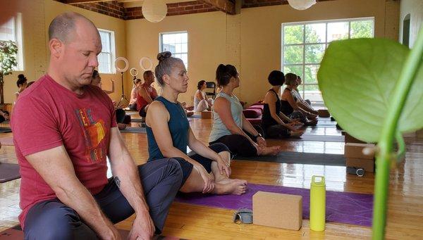 Students sit for meditation