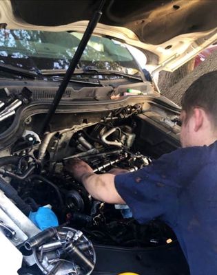 Our lead mechanic fixing a vehicle