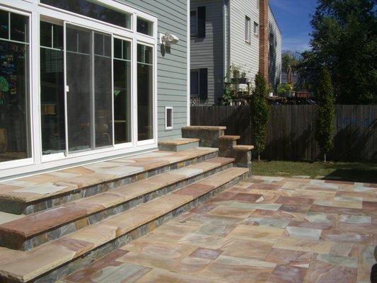 Close-jointed flagstone patio with steps down