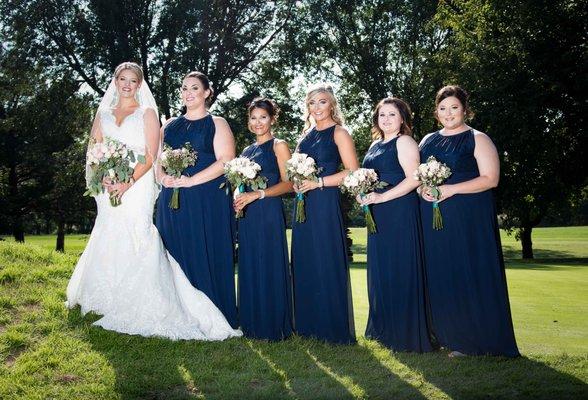 A beautiful gown and bridesmaids from Mori Lee Bridal.