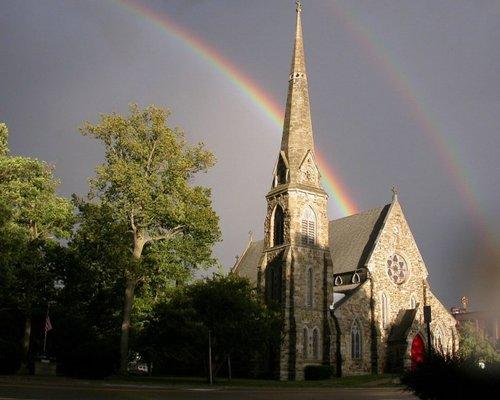 The church as photographed one overcast day features a rare double rainbow. Photo by Ken Corey.