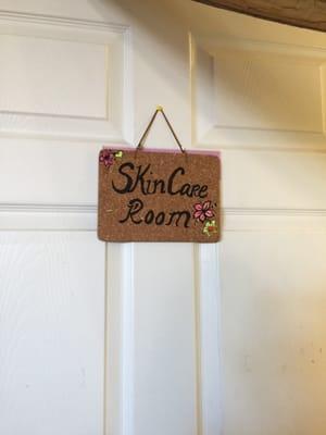 Cute sign hanging on the door. She's inside the Sunflower Nail shop.