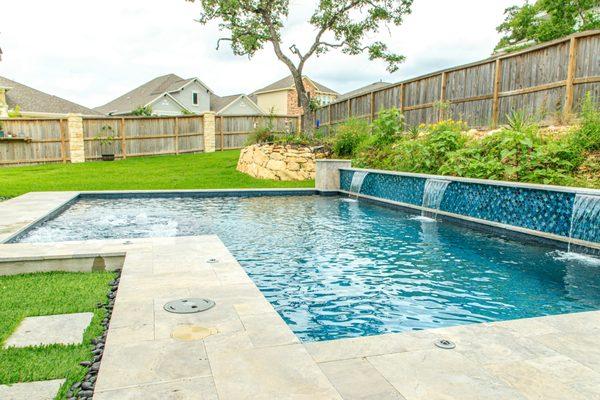 A smaller pool that makes a big statement with it's bold, reflective, tile wall