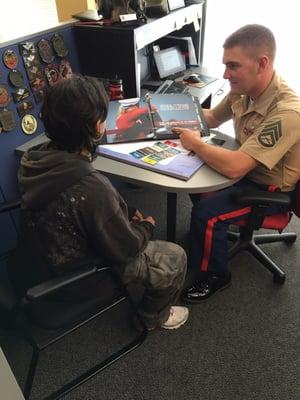 Staff Sergeant Brown providing information to an applicant.