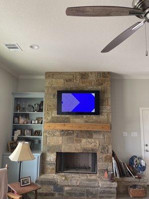 Mounted TV on stone fireplace. Relocated all wires up behind the television