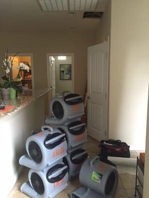 Prepping the dryers to place around the house where there was water damage.