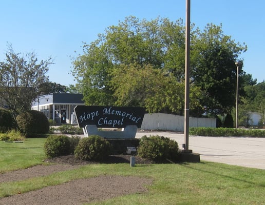 This is the sign that you'll see from the road if you're traveling west on Rt 1.  It's easy to miss.