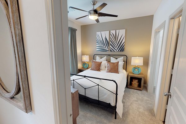 Bedrooms feature ceiling fans and plush carpeting