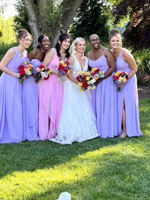 Bridesmaids with bride after ceremony in Turf Valley Resort Garden.